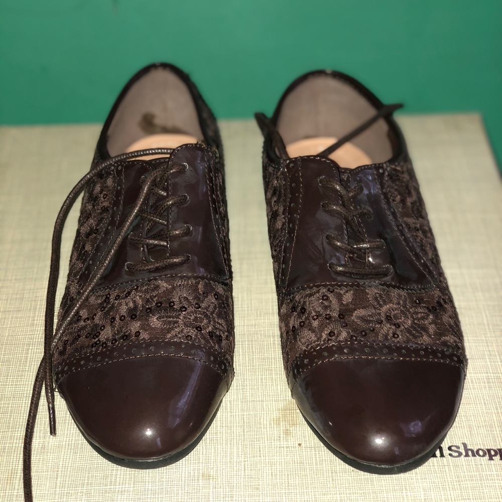 Brown patent leather and lace shoes
